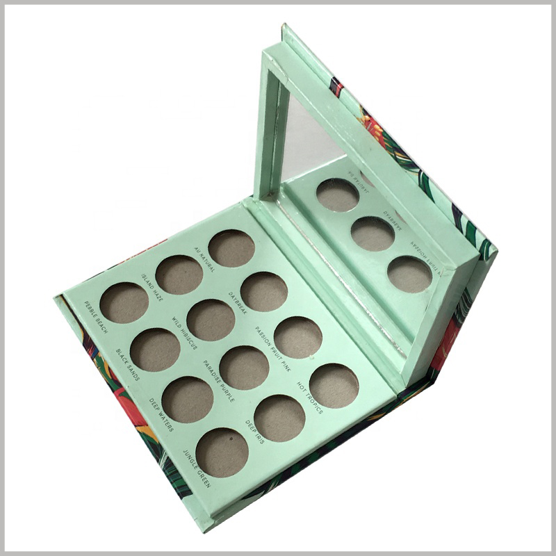 12 color eyeshadow palette packaging with mirror.The interior of the custom packaging is light green, promoting the concept of pure natural cosmetics.