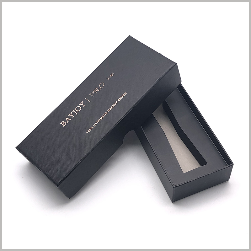 Black small cardboard boxes for single makeup brush packaging. The front panel of the customized cosmetic brush box is bronzing printed with brand information and product models.