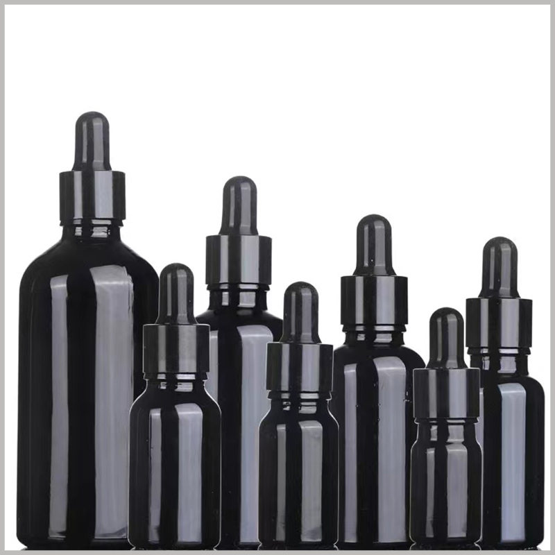 Bright Black Essential Oil Bottle with black rubber cap. Black essential oil bottle, black ring cap, and black rubber cap.