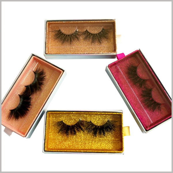 Custom Cardboard drawer eyelash packaging box with window and ribbon. There are many types of luxury eyelash packaging, from which you can choose the most suitable eyelash packaging and wholesale.