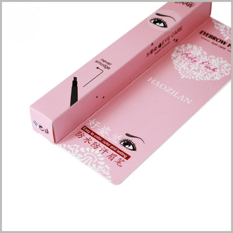 Custom pink small product boxes for eyeliner pencil packaging. The style of the eyeliner and the picture of the scene after use are printed on the small box.