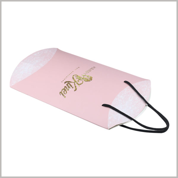 Foldable Pink pillow boxes for hair bundles packaging. Pillow boxes packaging is an easy-to-fold product packaging with low manufacturing cost and low transportation cost.
