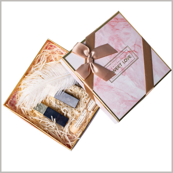 Gift packaging for lipstick subscription boxes.On the front of the custom packaging box, wide silk cloth is used as gift bows, which effectively increases the value of the product.