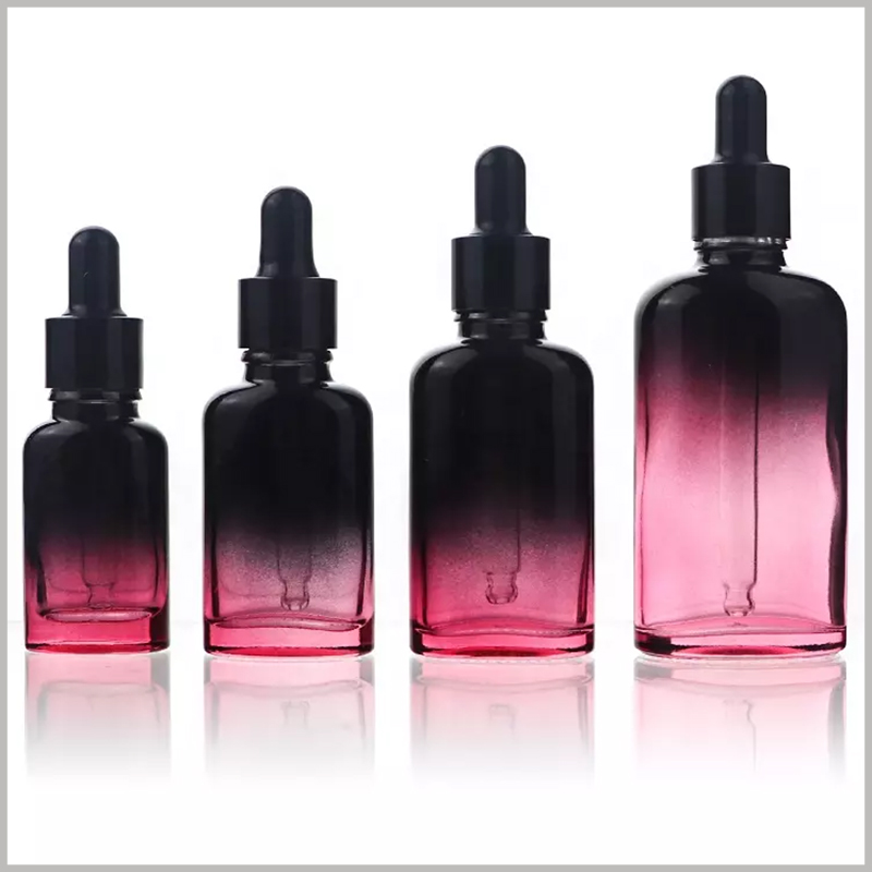 Oval essential oil dropper bottles with color, black and rose to enhance the liquid's light sensitivity and protection.
