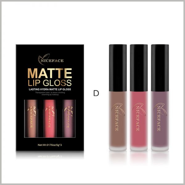 Three bottles of black lip gloss packaging boxes with windows. The interior of the lip gloss packaging uses blister to fix the product in a specific position.
