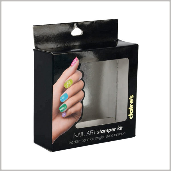 black packaging box for nail art stamper kit. The hands behind the nails are artistic and use them as the main promotional image for custom packaging.