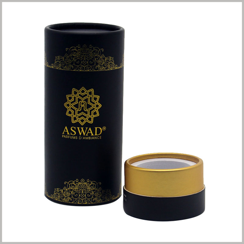 black round gift boxes for perfume bottles packaging. The logo and pattern on the paper tube are printed with bronzing, which has a good visual experience.