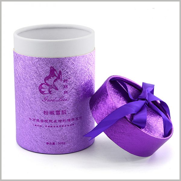 cardboard tube gift boxes packaging for skin care products.The purple silk ribbon as a gift knot is located on the top of the paper tube, which increases the value and value of the product.