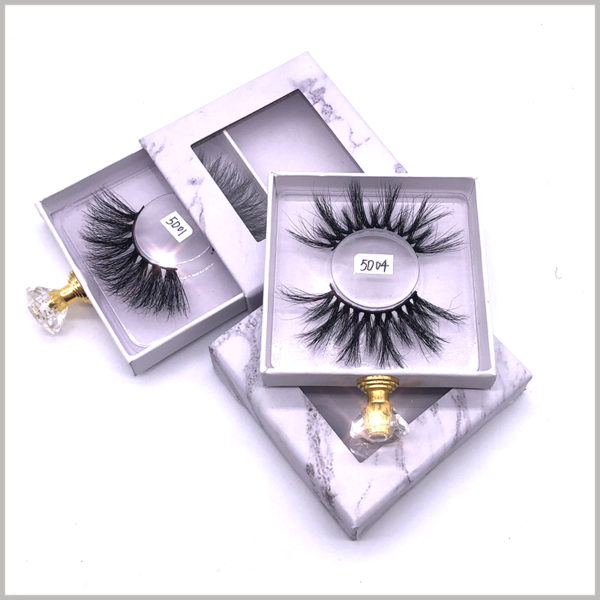 custom small cardboard drawer boxes for lashes packaging.The inside of the custom package has a clear blister to hold false eyelashes.