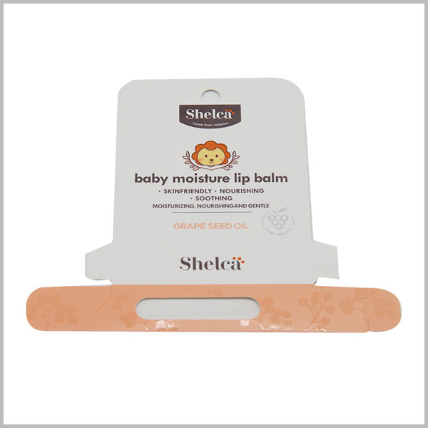 foldable baby moisture lip balm packaging with hang tags. This packaging box uses a folding carton structure, the entire packaging box can be unpacked and tiled into one layer, saving space and convenient transportation.