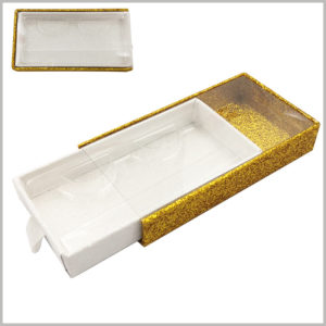 gold Cardboard drawer eyelash packaging box with window and ribbon. The golden cardboard outer drawer box has transparent windows, while the inner drawer box is shiny white.