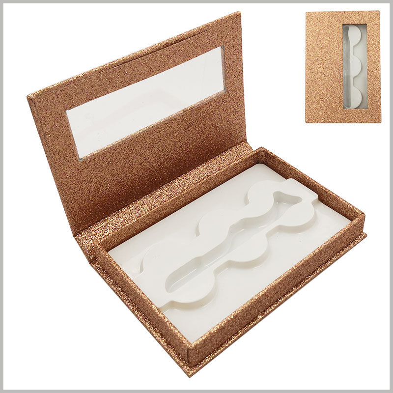 gold shiny eyelash packaing box with window for lot of 3 pairs. The inside of the gold card carton package has white plastic fixed eyelashes, and the top cover has a transparent window to see part of the product style.