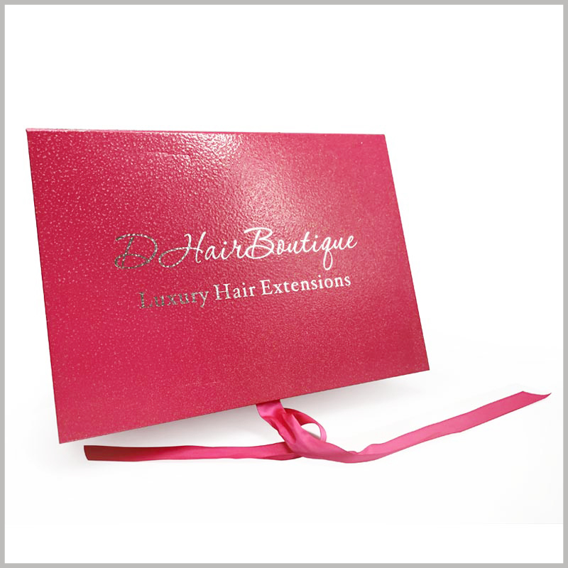 large red gift boxes for hair extensions packaging. The surface of the hair extension packaging adopts light glue technology, the packaging looks more shiny and has a slight reflection.