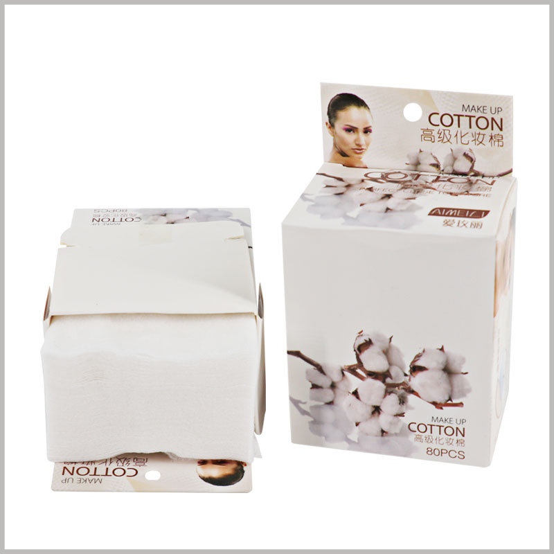 Custom makeup cotton pads packaging boxes. The label surface of the cosmetic packaging has circular holes, allowing the product to be hung on the shelf for display.