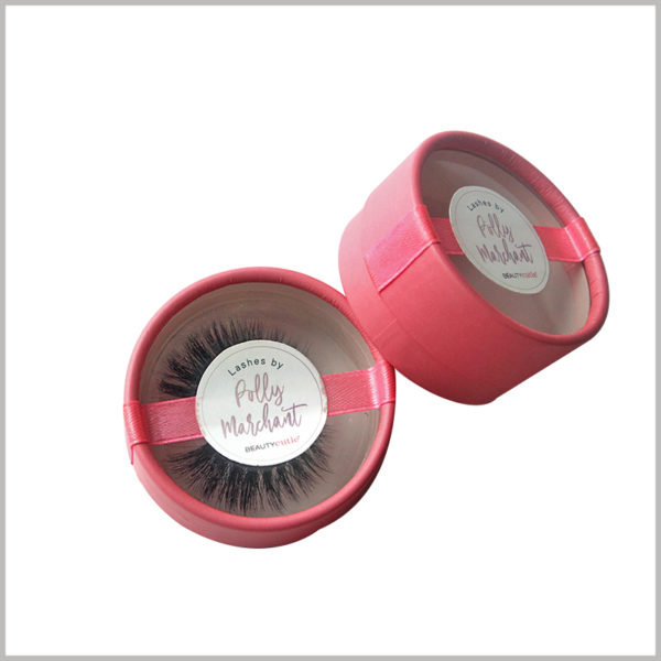 pink cardboard tube for false eyelash packaging box.a pink ribbon that girls like is added to the box cover as a decoration, and a circular sticker with a brand LOGO printed on the middle of the box cover.