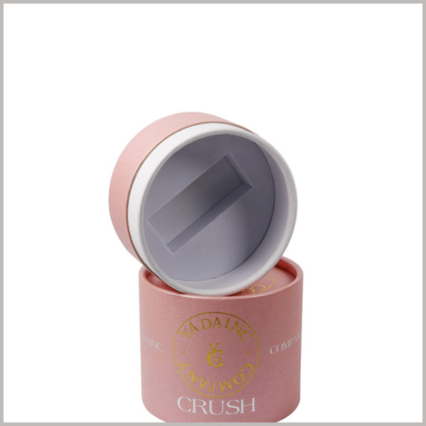 pink small cardoard tube packaging with eva insert, The inside of the cylindrical box lid has a white EVA groove designed according to the shape of the perfume bottle cap.