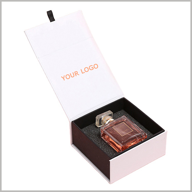 white cardboard perfume boxes packaging with logo. There is a sponge insert inside the square cardboard boxes, which can fix the perfume glass bottle to prevent the product from shaking and moving inside the package.