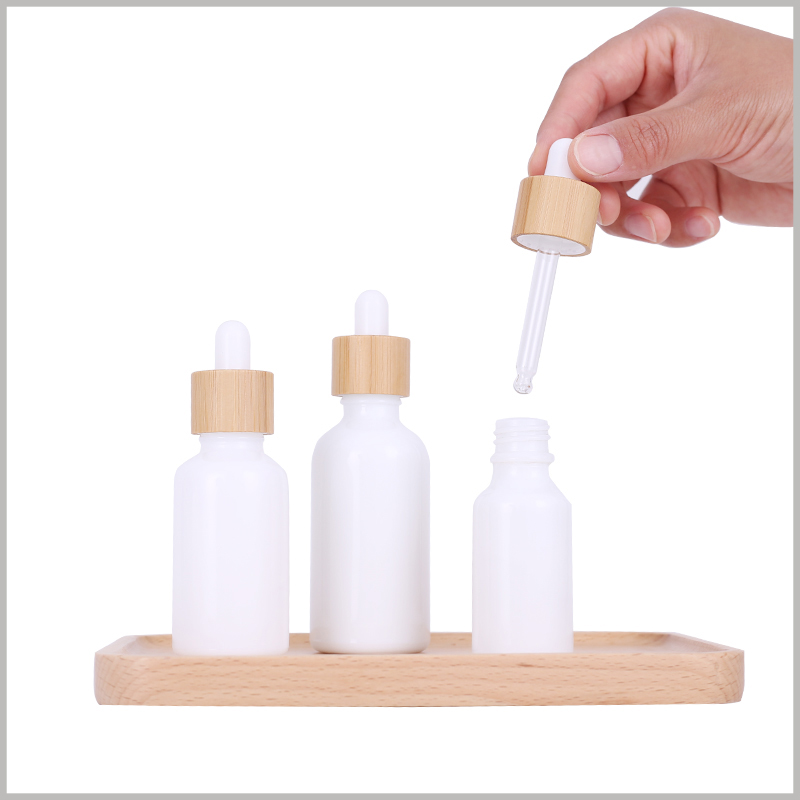 white essential oil dropper bottles wholesale. Essential oil bottles can choose wooden lids, which are very attractive and can add value to the product.