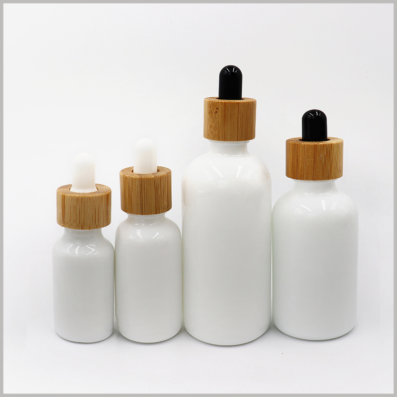 white essential oil dropper bottles with different caps. You can choose a white or black rubber cap according to your needs.