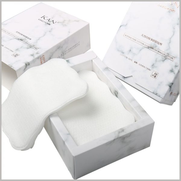 white small cotton pads box packaging. The inner packaging box is specially designed and folded, and the inner packaging box appears to have a large thickness, which improves the value of cosmetic packaging.