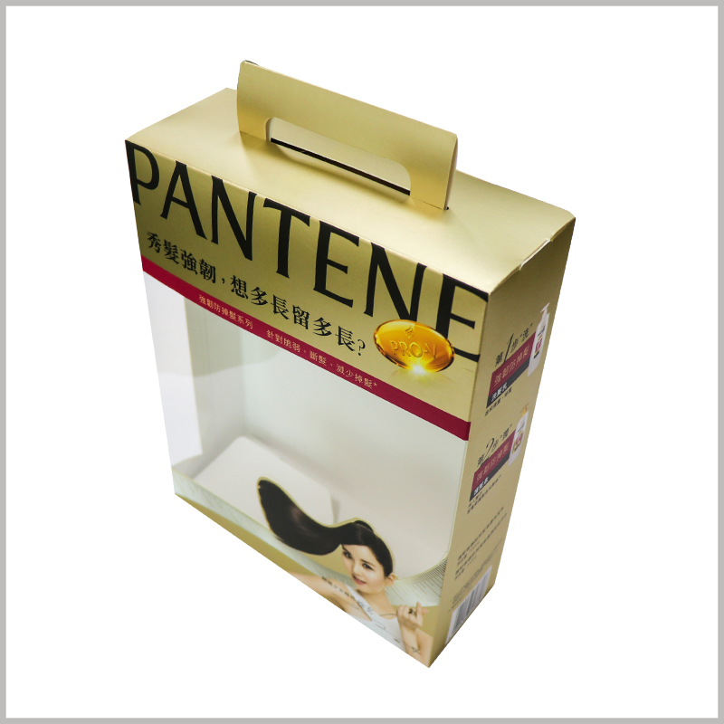 wholesale foldable shampoo packaging box with windows. The golden shampoo packaging has a paper hook on the top, which will hang the packaging and products on the shelves for display and sales.
